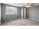 Bedroom with neutral carpet, ceiling fan and a window at 4111 Stratfield Dr, New Port Richey, FL 34652