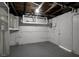 Garage area showing utilities, water heater, and ample storage at 4111 Stratfield Dr, New Port Richey, FL 34652