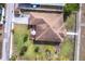 Real estate showcasing a well-maintained roof, wooden deck, and lush backyard at 5253 1St N Ave, St Petersburg, FL 33710