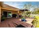 Expansive backyard deck featuring a pergola, dining area, and sliding glass doors to the home's interior at 5253 1St N Ave, St Petersburg, FL 33710