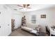 Bedroom featuring a futon, bookcase, desk, and a window with bright light at 5253 1St N Ave, St Petersburg, FL 33710