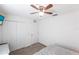 Bright bedroom with ceiling fan, double closets, and carpeted floor at 5253 1St N Ave, St Petersburg, FL 33710