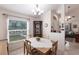 Bright dining room featuring a table for four, a china cabinet, and an open layout at 5253 1St N Ave, St Petersburg, FL 33710