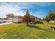 Beautiful home with a lush lawn, mature trees, and a cozy backyard deck at 5253 1St N Ave, St Petersburg, FL 33710