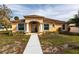 Charming single-story home with a well-manicured lawn and a welcoming columned entryway at 5253 1St N Ave, St Petersburg, FL 33710