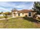 Beautifully landscaped front yard and inviting facade of a single-story home on a sunny day at 5253 1St N Ave, St Petersburg, FL 33710