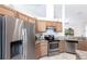 Modern kitchen with stainless steel appliances, granite countertops, and abundant cabinet space at 5253 1St N Ave, St Petersburg, FL 33710