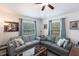 Bright living room showcasing neutral decor, two sofas, and large windows for ample natural light at 5253 1St N Ave, St Petersburg, FL 33710