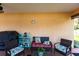 Cozy covered patio area features comfortable seating, perfect for relaxing outdoors at 5253 1St N Ave, St Petersburg, FL 33710