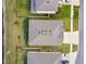 Birds eye view of the backyard showing fencing, grass, and exterior of home at 6674 Cobble Bliss St, Zephyrhills, FL 33541