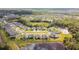 Aerial shot showcases a neighborhood with natural water features and lush trees at 6674 Cobble Bliss St, Zephyrhills, FL 33541