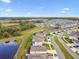 Aerial view shows a new neighborhood with ponds throughout the community at 6674 Cobble Bliss St, Zephyrhills, FL 33541