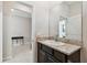 This bathroom vanity features dark wood cabinets and granite countertops at 6674 Cobble Bliss St, Zephyrhills, FL 33541