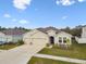 Charming one-story home with a two car garage, well-maintained lawn, and neutral stucco exterior at 6674 Cobble Bliss St, Zephyrhills, FL 33541