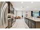 Modern kitchen with stainless steel appliances and granite countertops at 6674 Cobble Bliss St, Zephyrhills, FL 33541