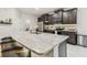 Large kitchen island with granite countertops and seating at 6674 Cobble Bliss St, Zephyrhills, FL 33541