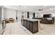 Open-concept kitchen flows into the living area, perfect for entertaining guests at 6674 Cobble Bliss St, Zephyrhills, FL 33541