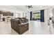 Expansive living area with kitchen, backyard access, and abundant seating at 6674 Cobble Bliss St, Zephyrhills, FL 33541