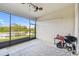 Enjoy this screened patio with a barbecue grill and tranquil views of the backyard pond at 6674 Cobble Bliss St, Zephyrhills, FL 33541