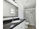 Updated bathroom featuring dark countertops and tiled stand-up shower at 706 Caliente Dr, Brandon, FL 33511
