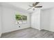 Bedroom with gray flooring, a ceiling fan, closet, and natural light at 706 Caliente Dr, Brandon, FL 33511
