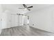 Bedroom features wood-look tile flooring, ceiling fan, sliding closet doors at 706 Caliente Dr, Brandon, FL 33511