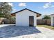A cabana sits adjacent to a paved backyard at 706 Caliente Dr, Brandon, FL 33511