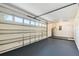 Two car garage featuring painted floor and access to water heater at 706 Caliente Dr, Brandon, FL 33511