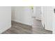 Hallway featuring modern gray flooring and fresh white walls at 706 Caliente Dr, Brandon, FL 33511