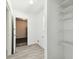 Neat laundry area with shelving and access to the garage at 706 Caliente Dr, Brandon, FL 33511