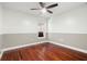 Bedroom featuring hardwood floors, a ceiling fan, neutral colored walls, and a window at 775 Brittany Park Blvd, Tarpon Springs, FL 34689