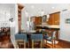 Well-lit kitchen features granite countertops, stainless steel appliances, and wooden cabinetry at 775 Brittany Park Blvd, Tarpon Springs, FL 34689