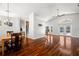 Spacious living room with hardwood floors, neutral paint, and French doors to the outdoors at 775 Brittany Park Blvd, Tarpon Springs, FL 34689