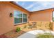 Exterior courtyard features decorative rock, plants, and a seating area at 8215 Hixton Dr, Port Richey, FL 34668