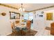 Quaint dining room features a round table, sunflower accents, and an open layout at 8215 Hixton Dr, Port Richey, FL 34668