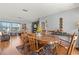 Dining room showcasing a wooden table, chairs, and ample space for hosting guests at 8215 Hixton Dr, Port Richey, FL 34668