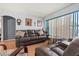 Inviting living room features a comfortable leather sofa and stylish decor for a cozy atmosphere at 8215 Hixton Dr, Port Richey, FL 34668
