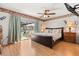 Comfortable main bedroom with sliding glass doors out to a pool and patio area at 8215 Hixton Dr, Port Richey, FL 34668