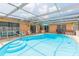 Enjoy outdoor living with this refreshing pool and screened enclosure at 8215 Hixton Dr, Port Richey, FL 34668