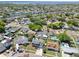 Wide aerial view of waterfront neighborhood with mature trees and community waterways at 8326 Archwood Cir, Tampa, FL 33615