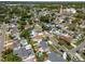 Birds-eye view of established neighborhood with mature landscaping and local roadways at 8326 Archwood Cir, Tampa, FL 33615