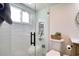 A stylish bathroom with a walk-in glass shower and built-in toiletries niche at 8326 Archwood Cir, Tampa, FL 33615