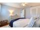 Bedroom with hardwood floors, area rug, dresser and ceiling fan at 8326 Archwood Cir, Tampa, FL 33615