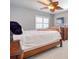 Comfortable bedroom featuring carpeted floors and a ceiling fan at 8326 Archwood Cir, Tampa, FL 33615