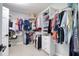 Walk-in closet with custom shelving and ample storage space at 8326 Archwood Cir, Tampa, FL 33615