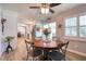 Cozy dining area with wood table and views to the kitchen at 8326 Archwood Cir, Tampa, FL 33615