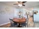 Inviting dining area with views of kitchen and decorative wall accents at 8326 Archwood Cir, Tampa, FL 33615