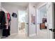 Hallway leading to bathroom, bedroom, and walk-in closet at 8326 Archwood Cir, Tampa, FL 33615