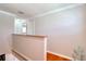 Hallway featuring hardwood floors, crown molding, and storage at 8326 Archwood Cir, Tampa, FL 33615