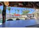 A covered tiki bar provides shade while overlooking the pool and backyard space at 8326 Archwood Cir, Tampa, FL 33615